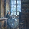 Femme au chat devant la fenêtre